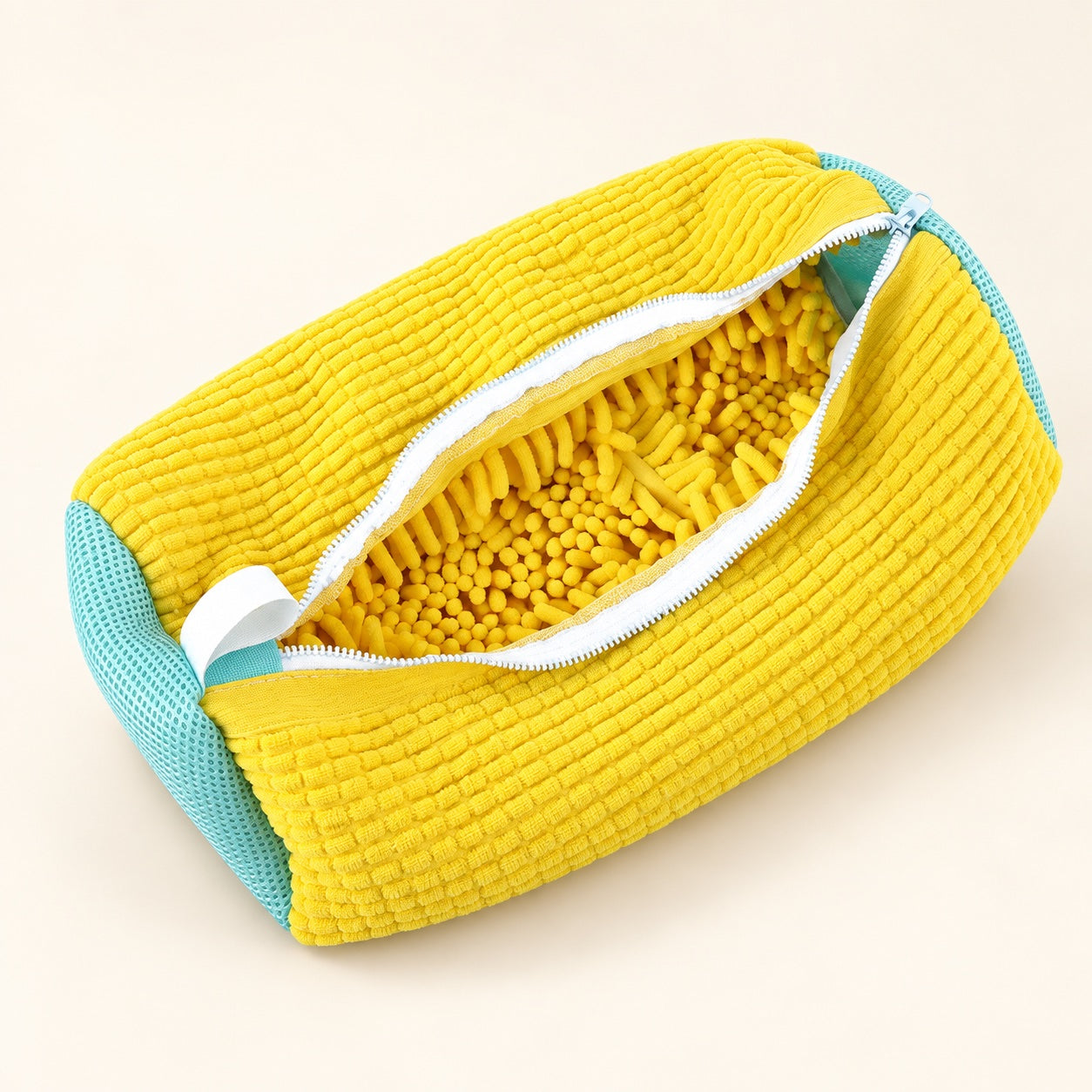 Open yellow ScrubKix shoe wash bag with soft chenille lining and aqua mesh ends